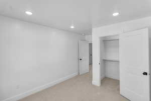 Bedroom 3 featuring light carpet and recessed lighting
