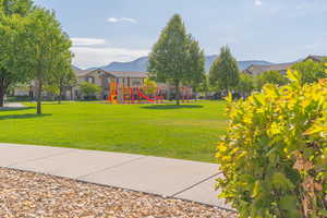 View of grassy yard featuring a mountain view