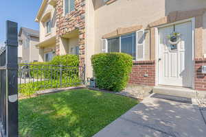 Doorway to property featuring stucco siding