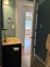 Bathroom with vanity and light tile patterned floors