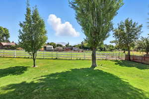 View of yard featuring a rural view and a mountain view