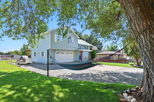 View of front of home with an attached garage and driveway