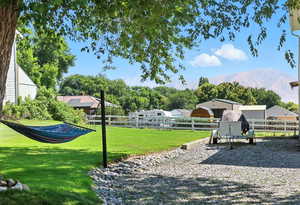 View of property's community featuring a mountain view and view of scattered trees