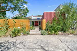 View of front of home and entrance to courtyard