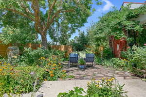 Fenced backyard featuring a patio