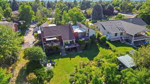 Aerial perspective of suburban area with a tree filled landscape