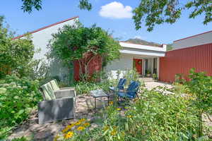 Back of house featuring a patio and stucco siding