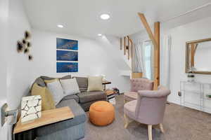Living area featuring carpet flooring and recessed lighting
