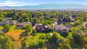Aerial perspective of suburban area featuring a mountain backdrop