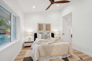 Bedroom featuring light wood-style flooring, recessed lighting, and ceiling fan