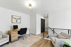 Office area featuring light wood finished floors and baseboards