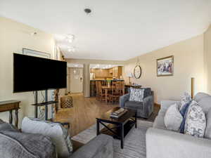 Living area featuring light wood finished floors and baseboards