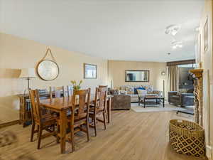 Dining area with light wood-style floors