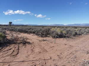 View of mountain backdrop with rural landscape