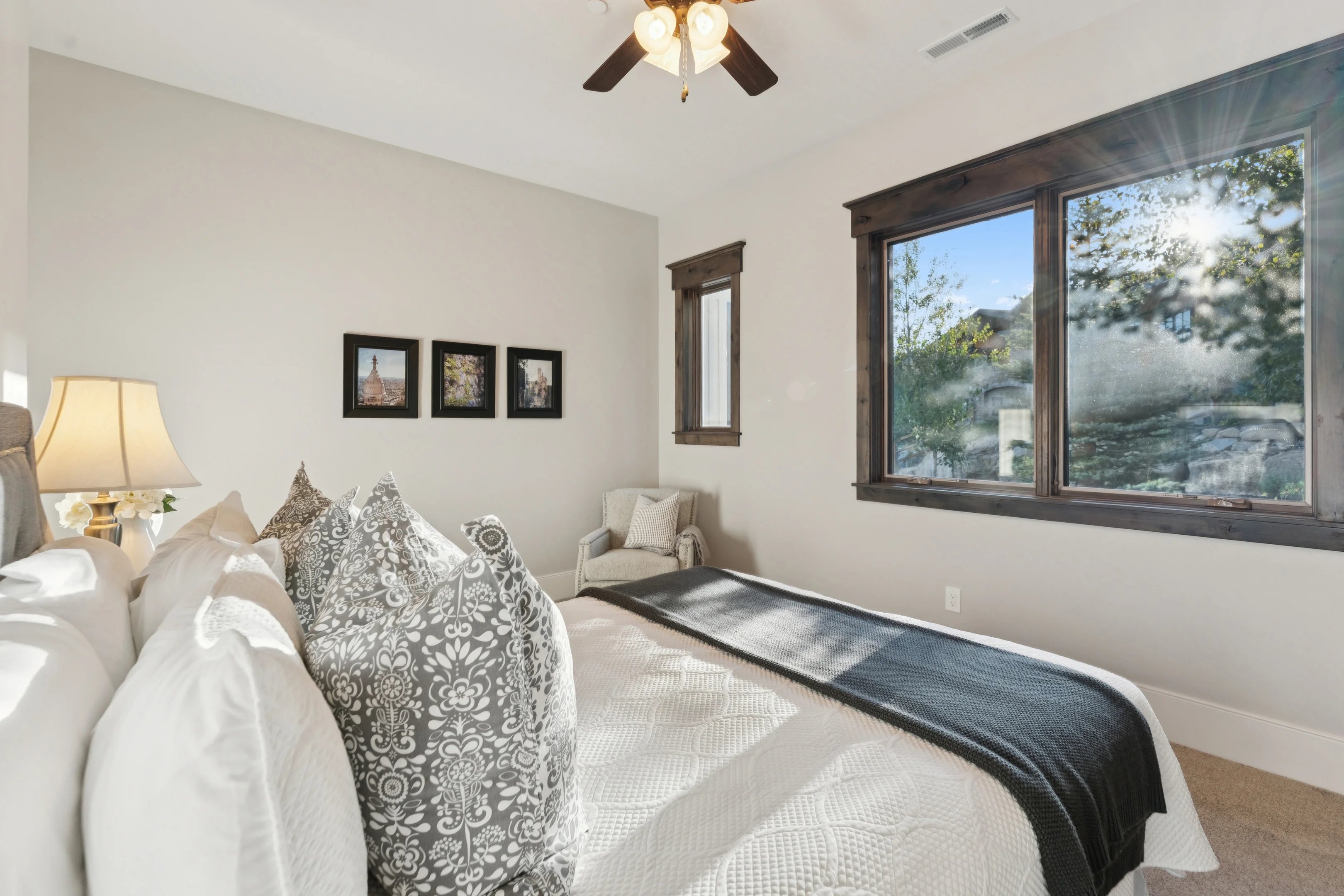 Carpeted bedroom featuring baseboards and ceiling fan