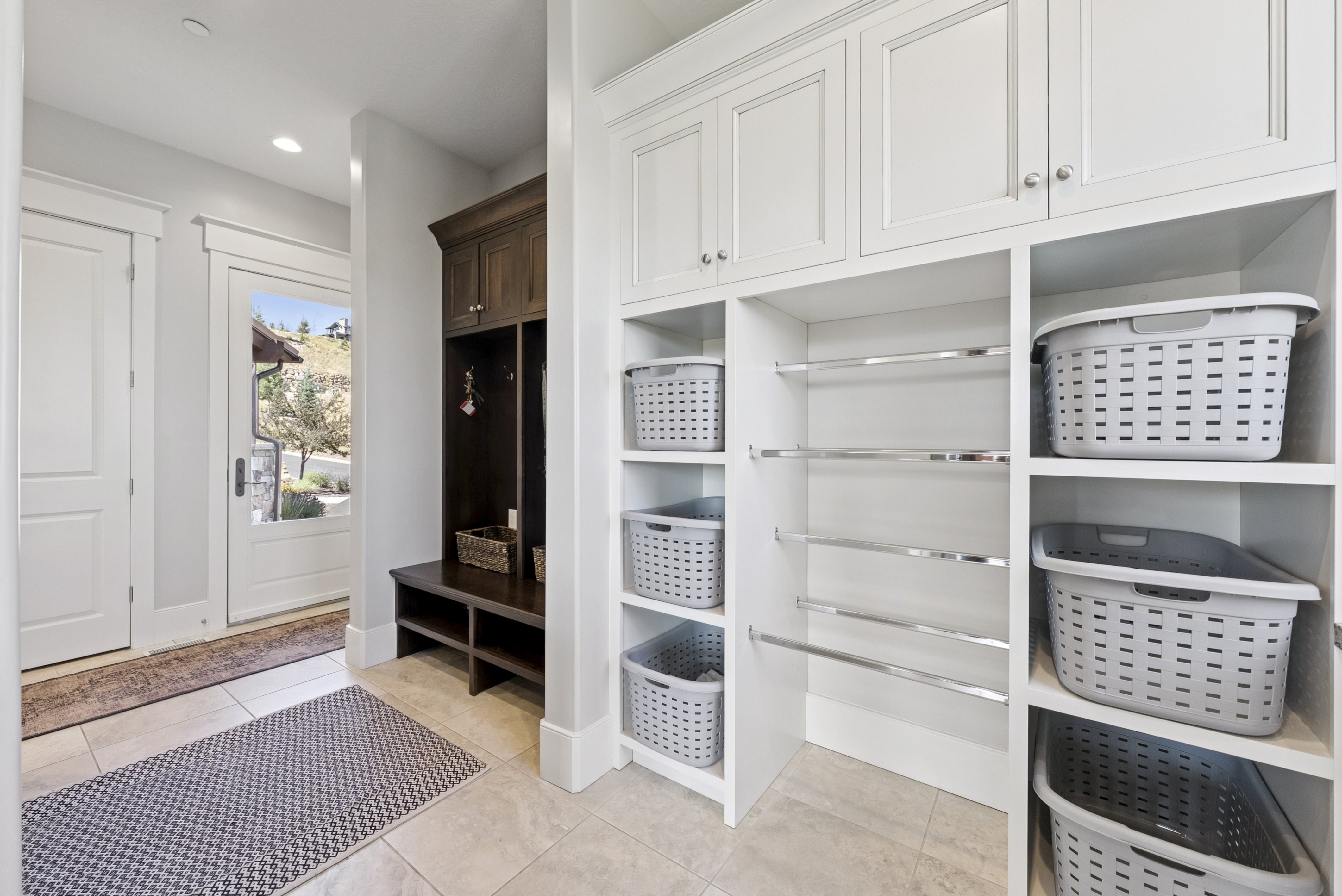 Mudroom featuring recessed lighting and light tile patterned floors