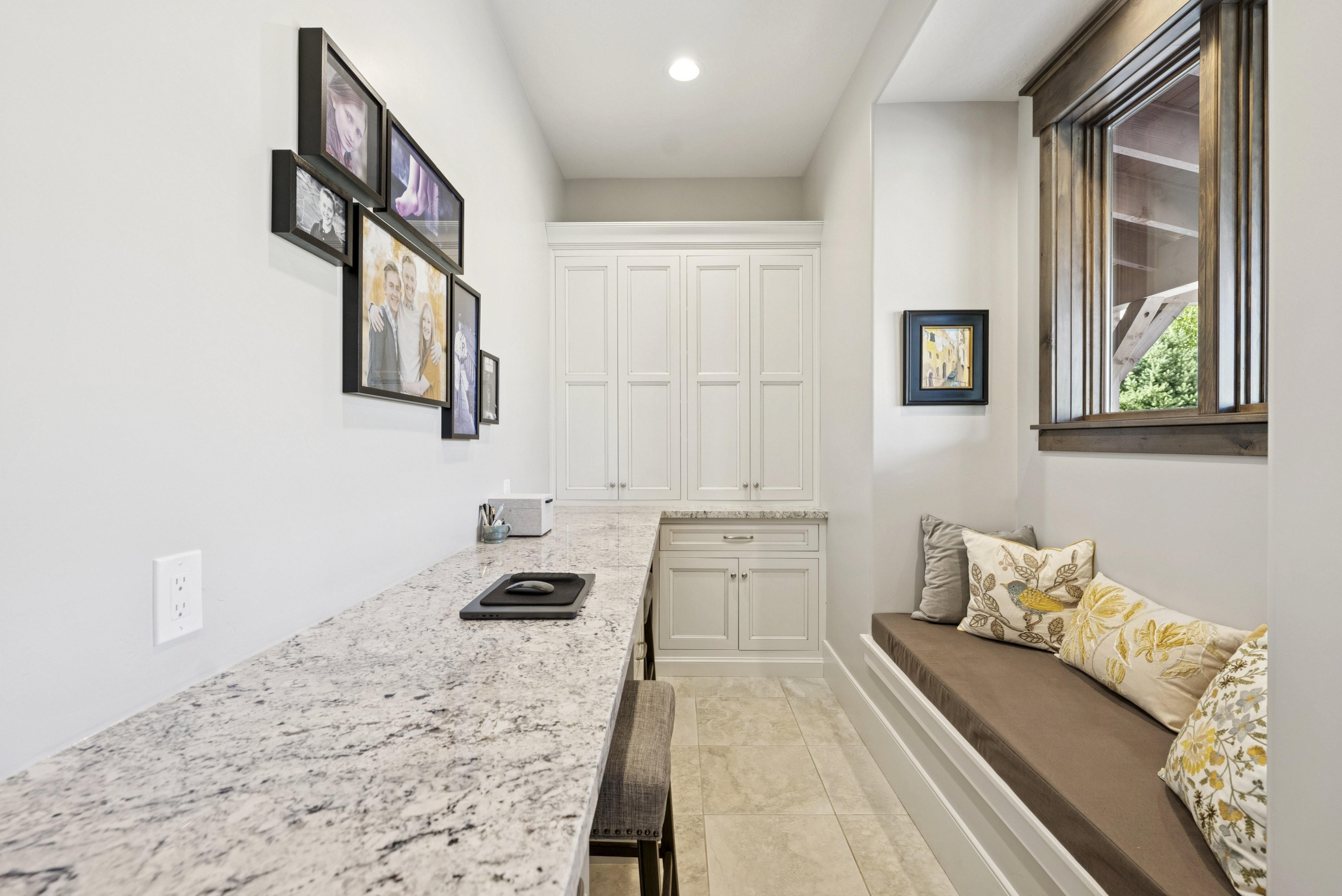 Mudroom with light tile patterned floors and recessed lighting