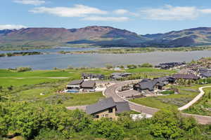 Aerial perspective of suburban area with a water and mountain view