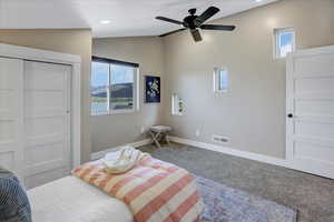 Bedroom with carpet floors, ceiling fan, and recessed lighting