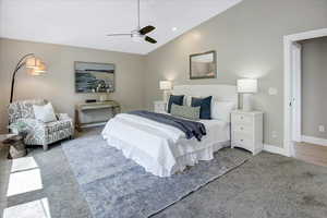 Carpeted bedroom with lofted ceiling, a ceiling fan, and recessed lighting