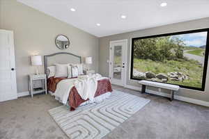 Bedroom featuring recessed lighting, access to outside, and light carpet