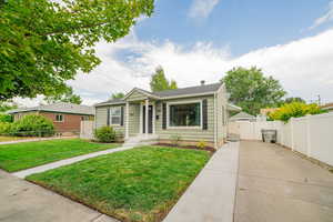 Bungalow-style house featuring a gate