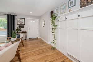Entryway featuring light wood finished floors and recessed lighting