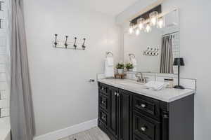 Full bathroom featuring vanity and shower / tub combo
