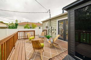 Wooden terrace with french doors and a patio area