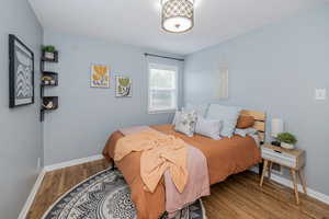 Bedroom featuring wood finished floors