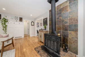 Hallway featuring light wood-style floors and recessed lighting