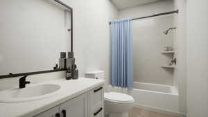 Bathroom featuring vanity, shower / tub combo with curtain, and light wood-style flooring
