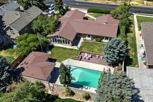 View of subject property with a pool