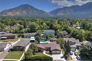 Aerial view of residential area featuring mountains
