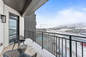 View of snow covered back of property