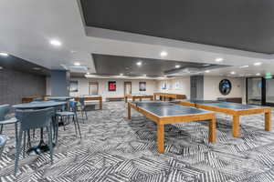 Recreation room with recessed lighting, billiards, carpet floors, and a tray ceiling