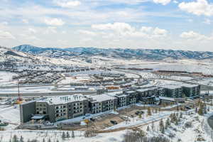 Snowy aerial view with a mountain view