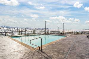 Community pool featuring a patio area