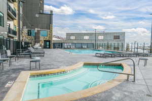 Community pool with a patio area