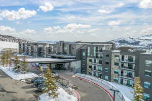 Snowy aerial view featuring a mountain view