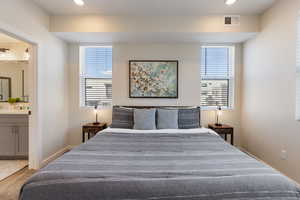 Bedroom featuring connected bathroom and recessed lighting