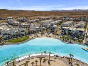 Community pool featuring a mountain view and a patio area