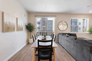 Dining area featuring light wood finished floors and baseboards