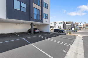 Partially covered parking lot with a residential view