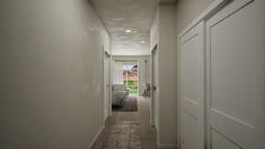Hallway featuring dark wood-type flooring and recessed lighting