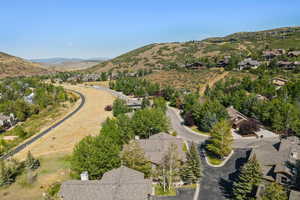 View of property location featuring a mountain backdrop and nearby suburban area
