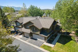 Aerial view of property and surrounding area with mountains