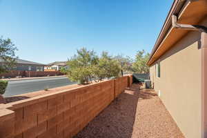 Fenced backyard with a residential view