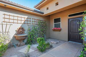 Property entrance with stucco siding