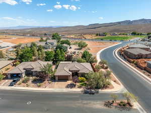 Aerial perspective of suburban area with a mountainous background